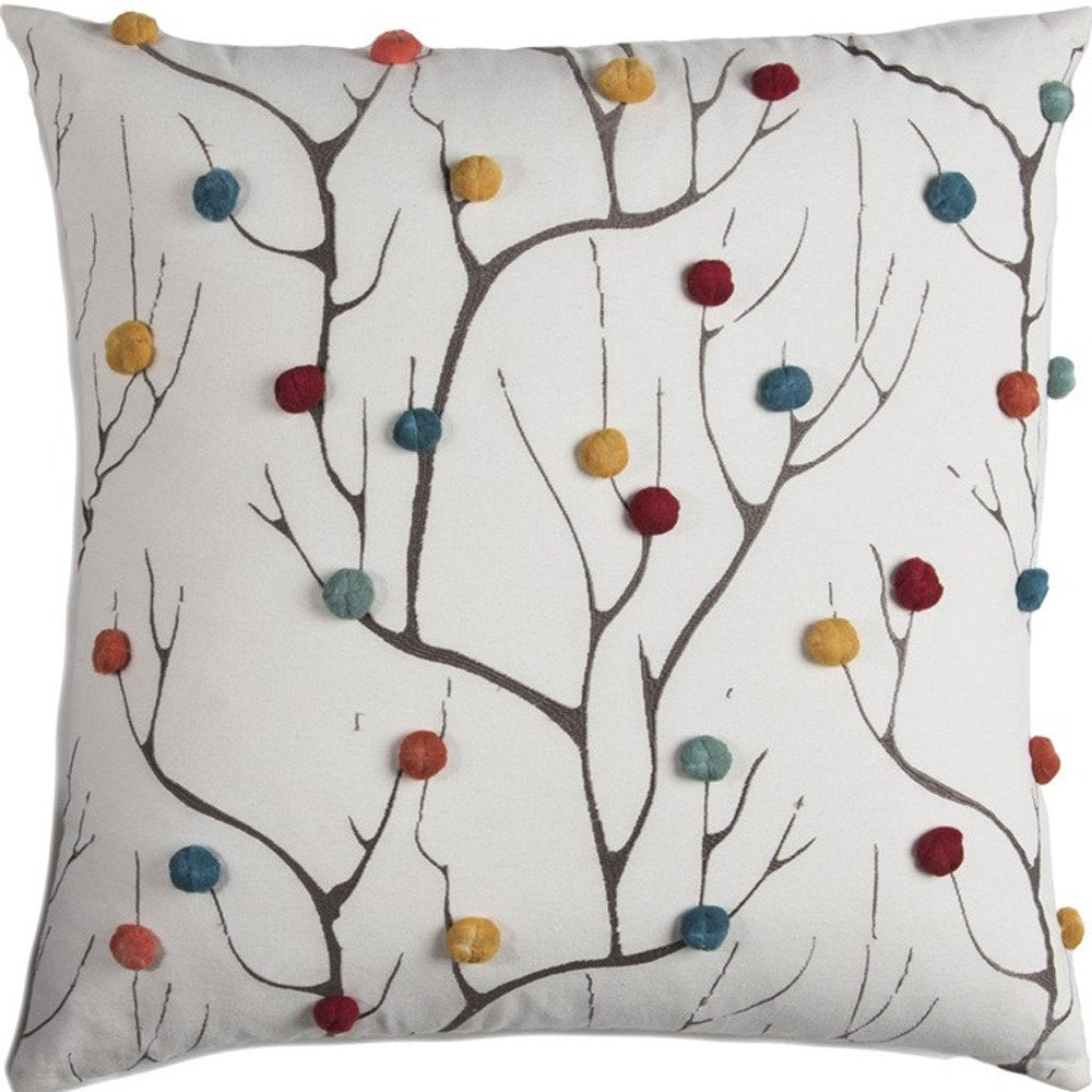 Close-up of 20" White And Black Coral Indoor Outdoor Throw Pillow With Pompoms showing white detail.