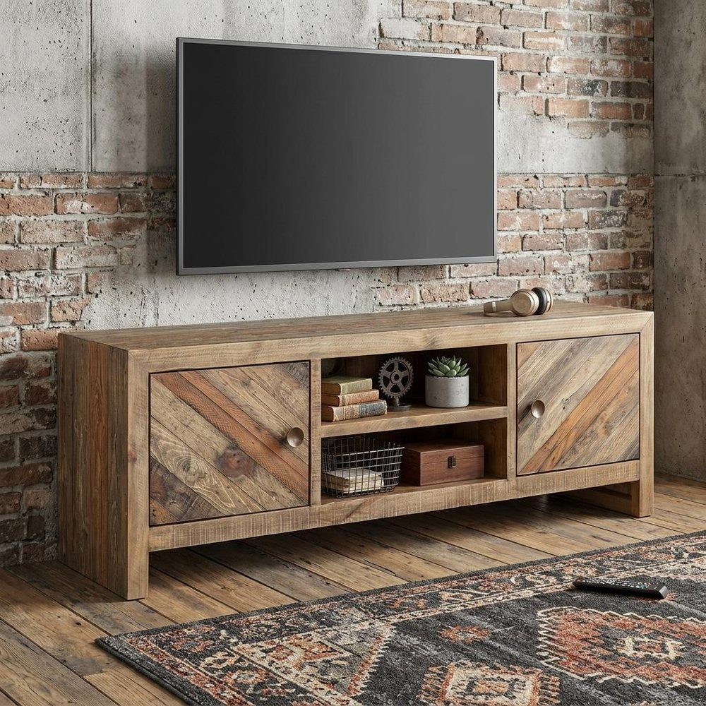 63" Wood Brown Reclaimed Pine And Plywood Open Shelving TV Stand styled in a furnished interior with a light gray wall on a wood floor.