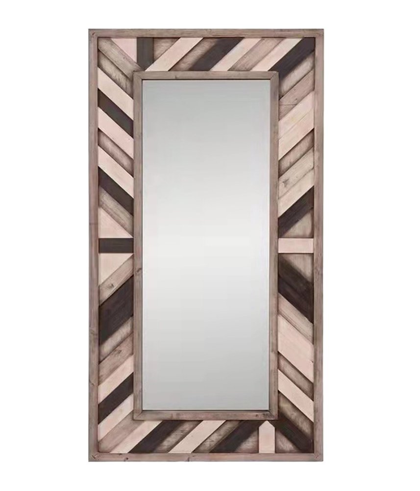 Rectangular leaning mirror with a distressed wood frame in ivory and gray chevron pattern.