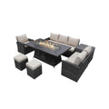 Seven Piece Brown Wicker Upholstered Cushions Sectional Seating Group With Fire Pit And Table on a white background