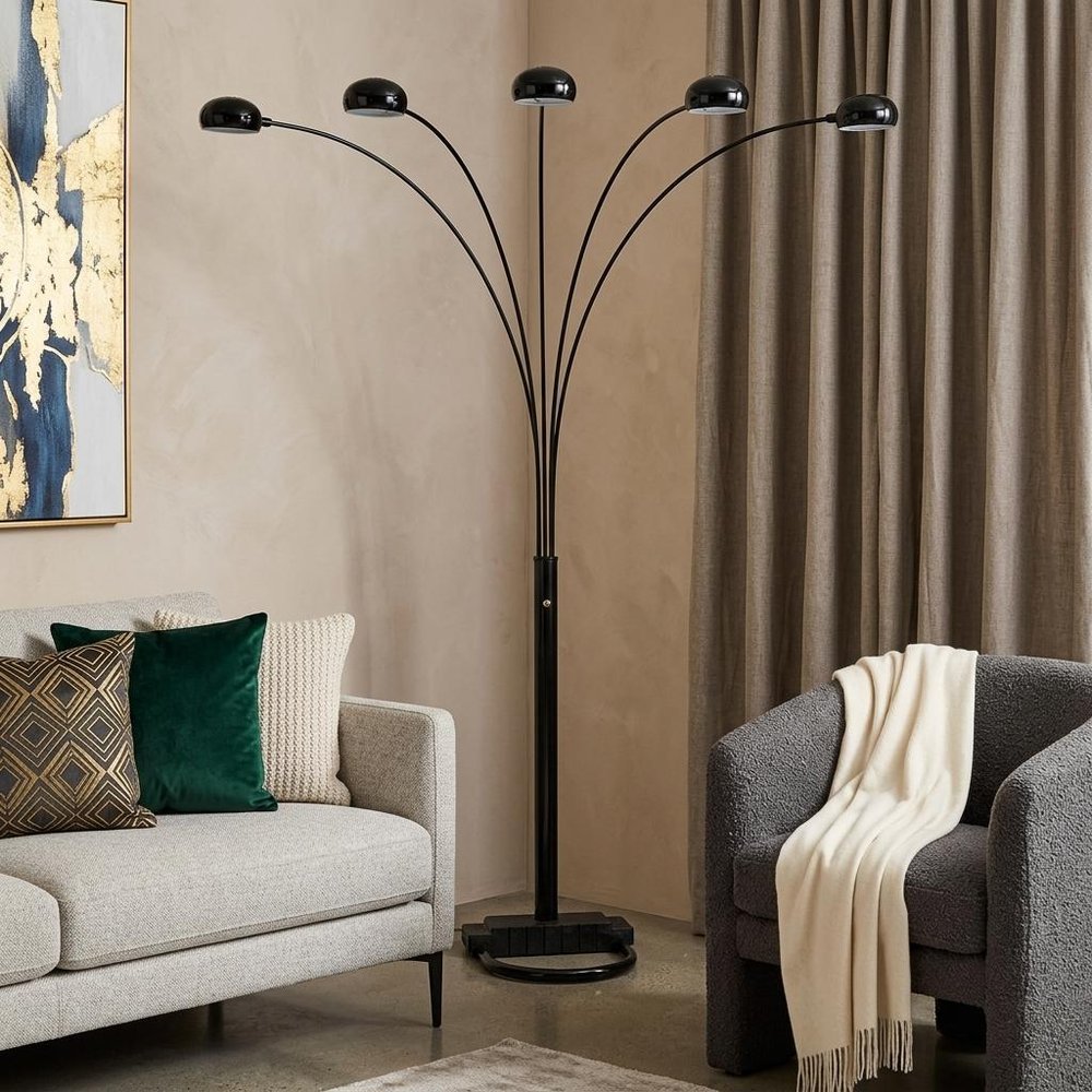 84" Black Five Light Arc Floor Lamp With Black Dome Shade in a home interior