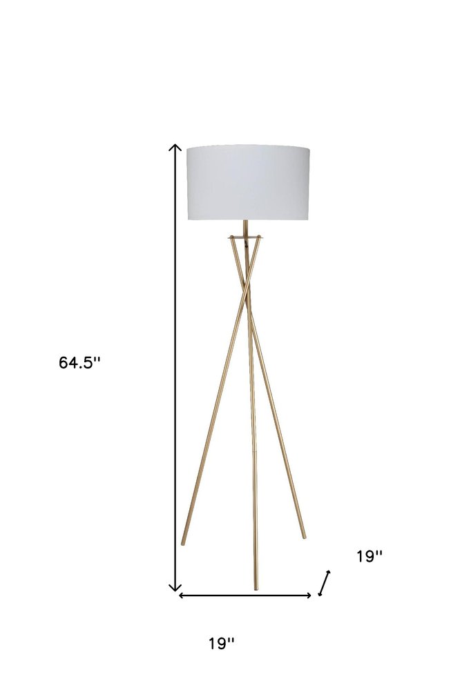 65" Gold And White Tripod Floor Lamp With White Fabric Drum Shade. Floor lamp isolated on a plain white background, showing a white metal surface.