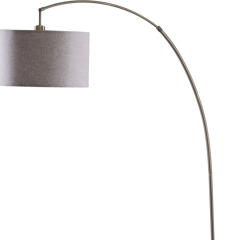 86" Beige And Antique Gold Arched Floor Lamp With Gray Drum Shade on a white background