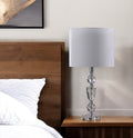 24" Clear And Silver Faux Crystal And Metal Table Lamp With White Drum Shade. Table lamp in silver crystal.