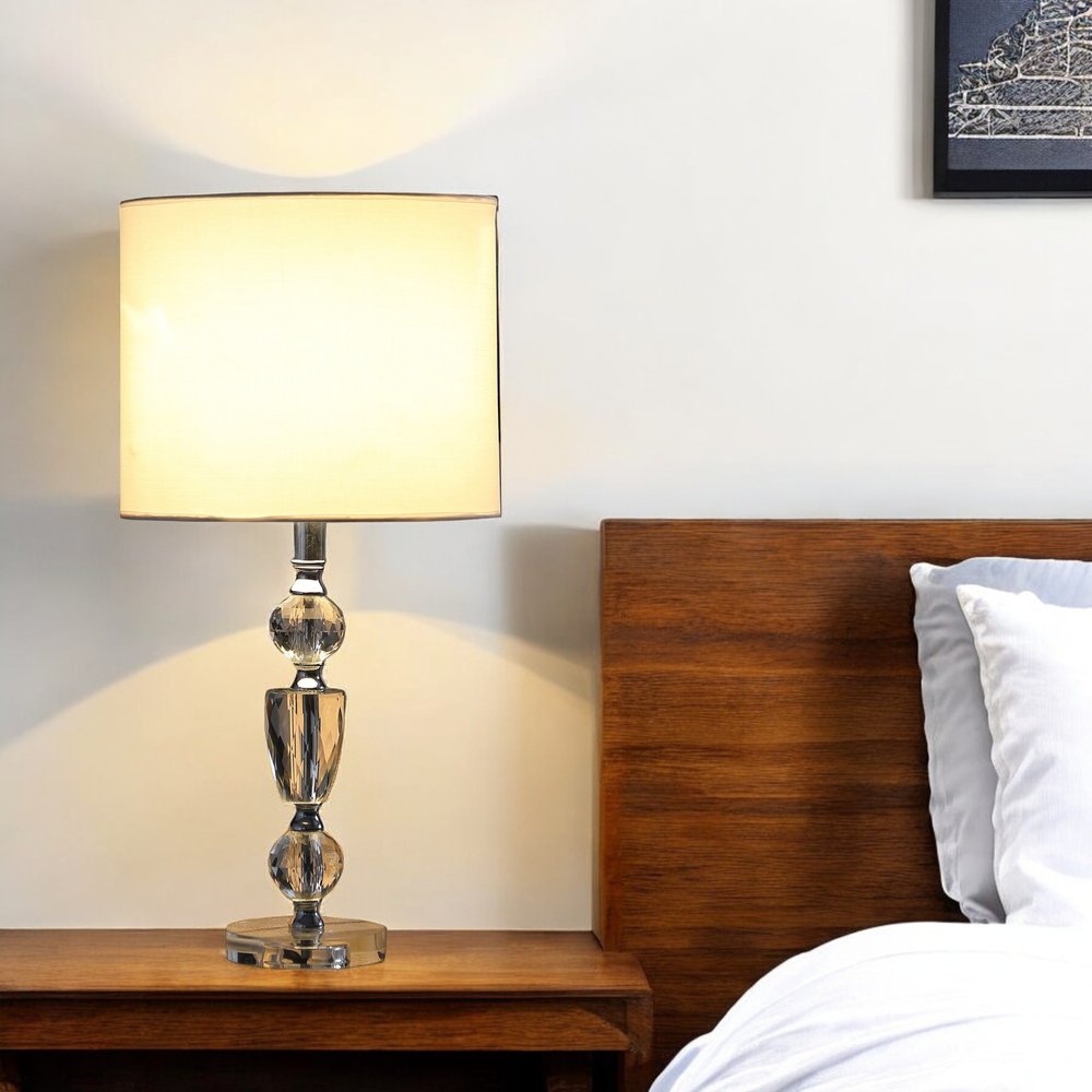 24" Clear And Silver Faux Crystal And Metal Table Lamp With White Drum Shade. Table lamp in white crystal.