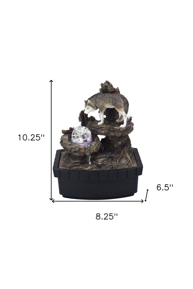 10" Black Polyresin Wolf Tabletop Fountain Sculpture. Sculpture isolated on a plain white background, in a black resin finish.