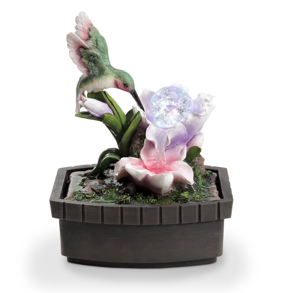 11" Pink Green And Brown Polyresin Hummingbird Tabletop Fountain. Home product isolated on a plain white background, showing a resin surface.