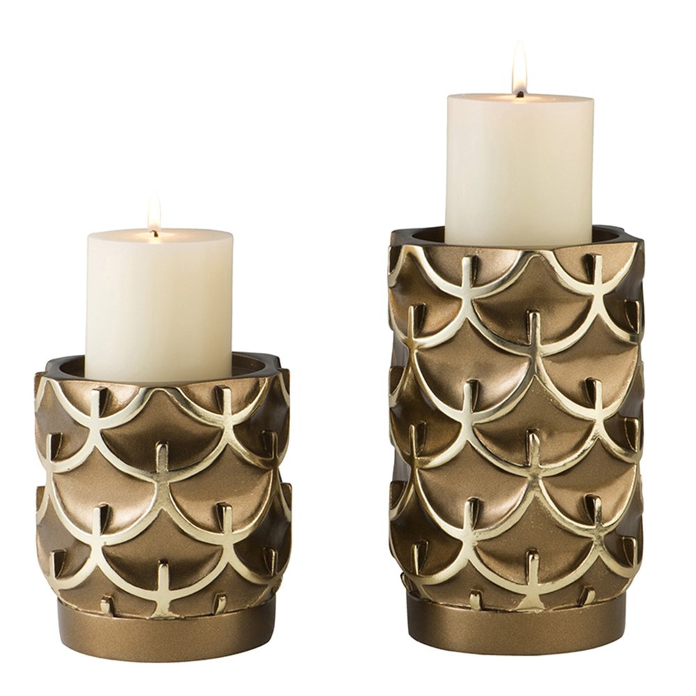 Set Of Two Antiqued Brass Tabletop Pillar Candle Holders on a white background
