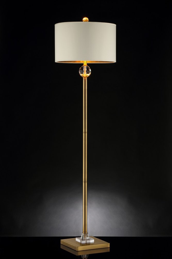 63" Gold Column Floor Lamp With Off White Metal Drum Shade photographed against a dark studio background in off-white.