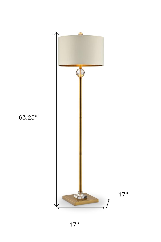 63" Gold Column Floor Lamp With Off White Metal Drum Shade. Floor lamp isolated on a plain white background, showing a off-white metal surface.