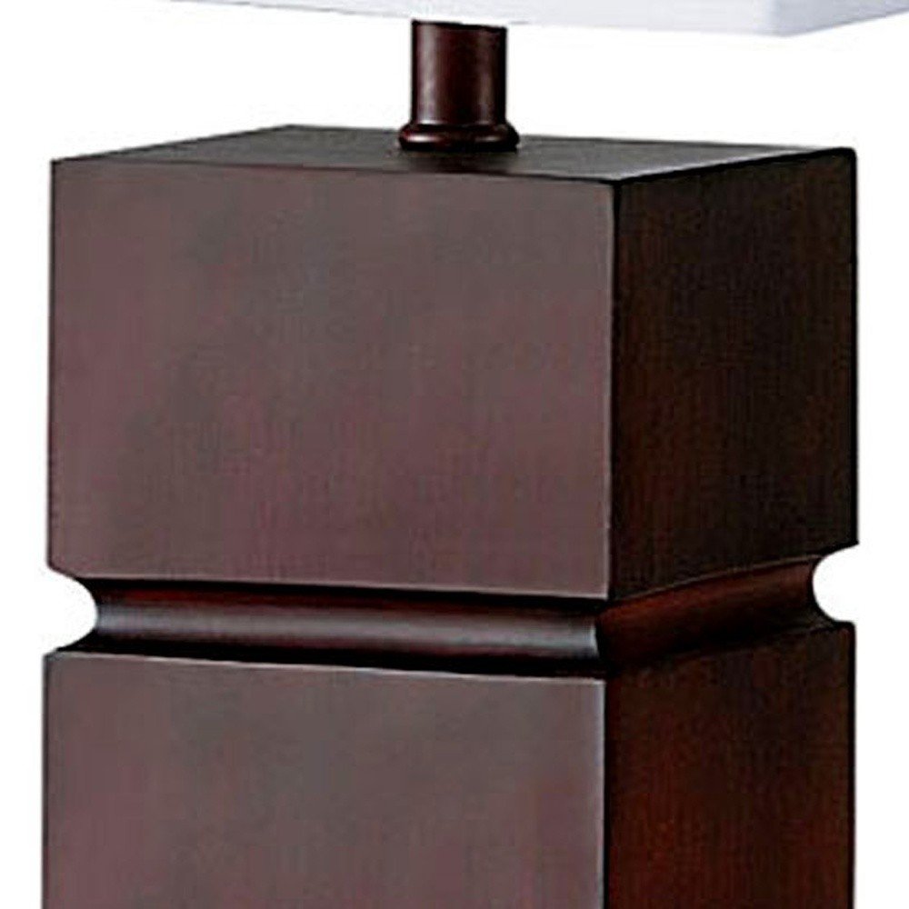 27" Brown Bedside Table Lamp With White Shade. Table lamp isolated on a plain white background, finished in brown.