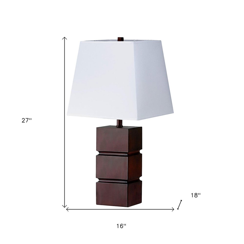 27" Brown Bedside Table Lamp With White Shade. Table lamp isolated on a plain white background, in a white finish.