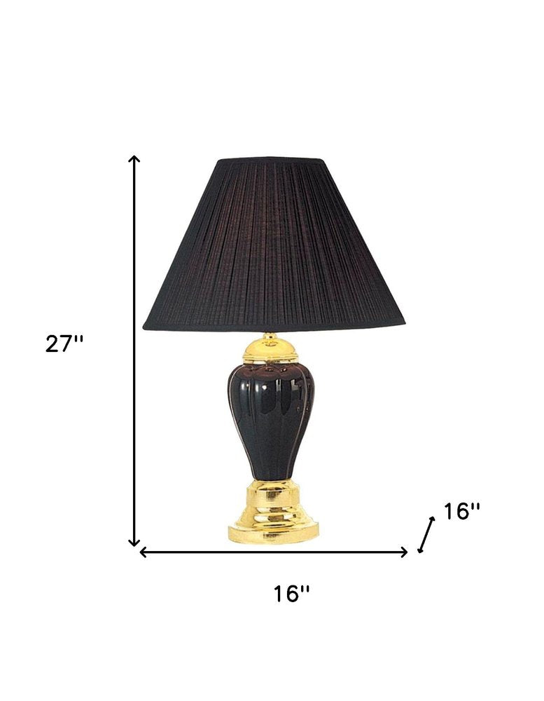 27" Black and Gold Ceramic Urn Table Lamp With Black Empire Shade. Table lamp isolated on a plain white background, finished in black ceramic.