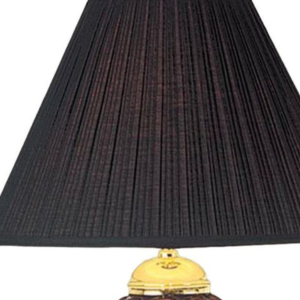 27" Black and Gold Ceramic Urn Table Lamp With Black Empire Shade. Table lamp isolated on a plain white background, in a gold ceramic finish.