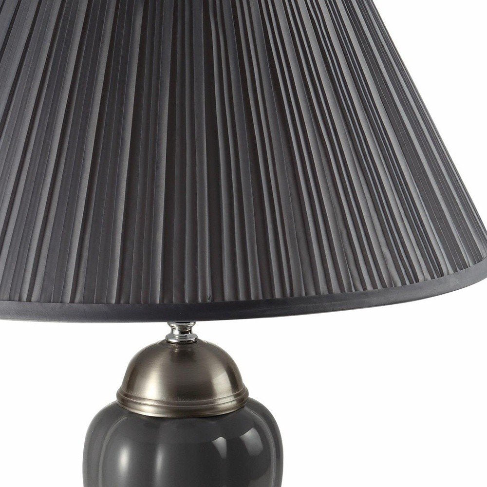 27" Gray and Silver Metal Urn Table Lamp With Gray Empire Shade. Table lamp in silver metal.