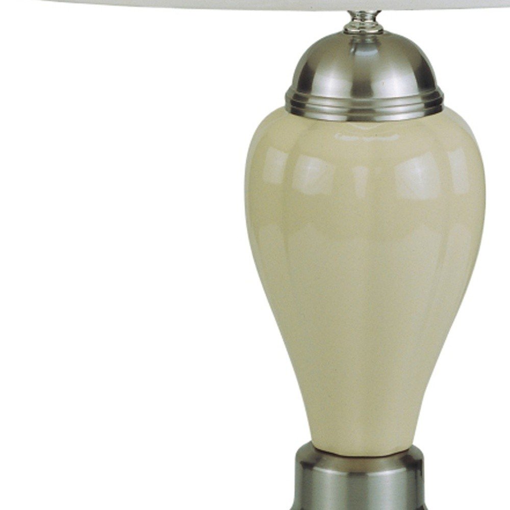27" Gray and Silver Metal Urn Table Lamp With Gray Empire Shade. Table lamp isolated on a plain white background, finished in silver metal.