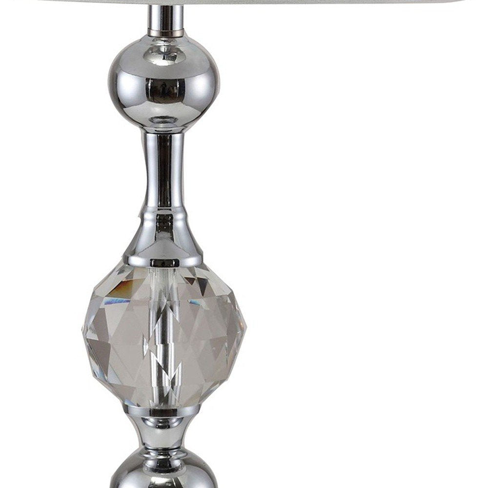30" Silver Metal Bedside Table Lamp With White Classic Drum Shade. Table lamp isolated on a plain white background, in a silver metal finish.
