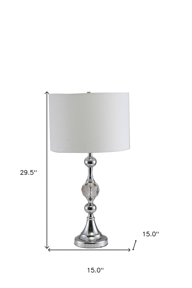 30" Silver Metal Bedside Table Lamp With White Classic Drum Shade. Table lamp isolated on a plain white background, in a silver metal finish.
