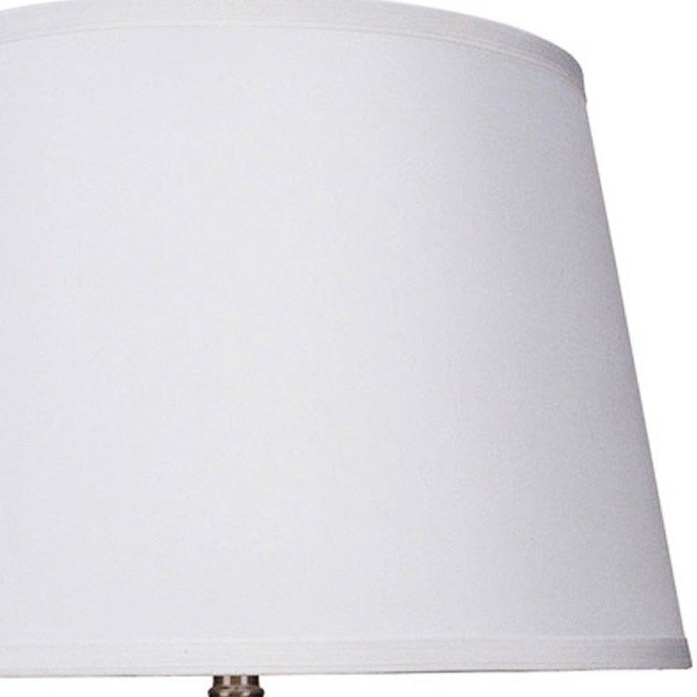 Cropped view of 29" Silver Metal Table Lamp With White Classic Empire Shade focusing on the silver metal surface.