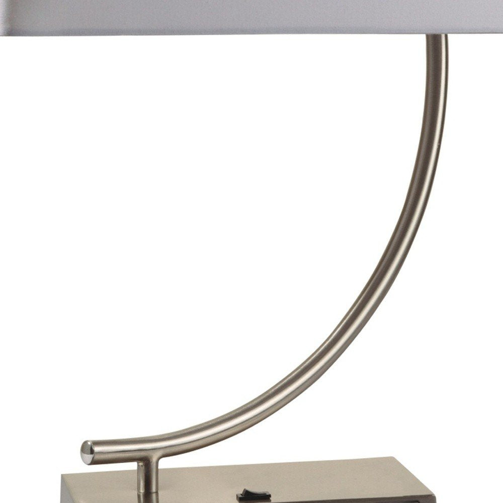 23" Silver Curved Table Lamp With White Rectangle Shade. Table lamp isolated on a plain white background, finished in silver.