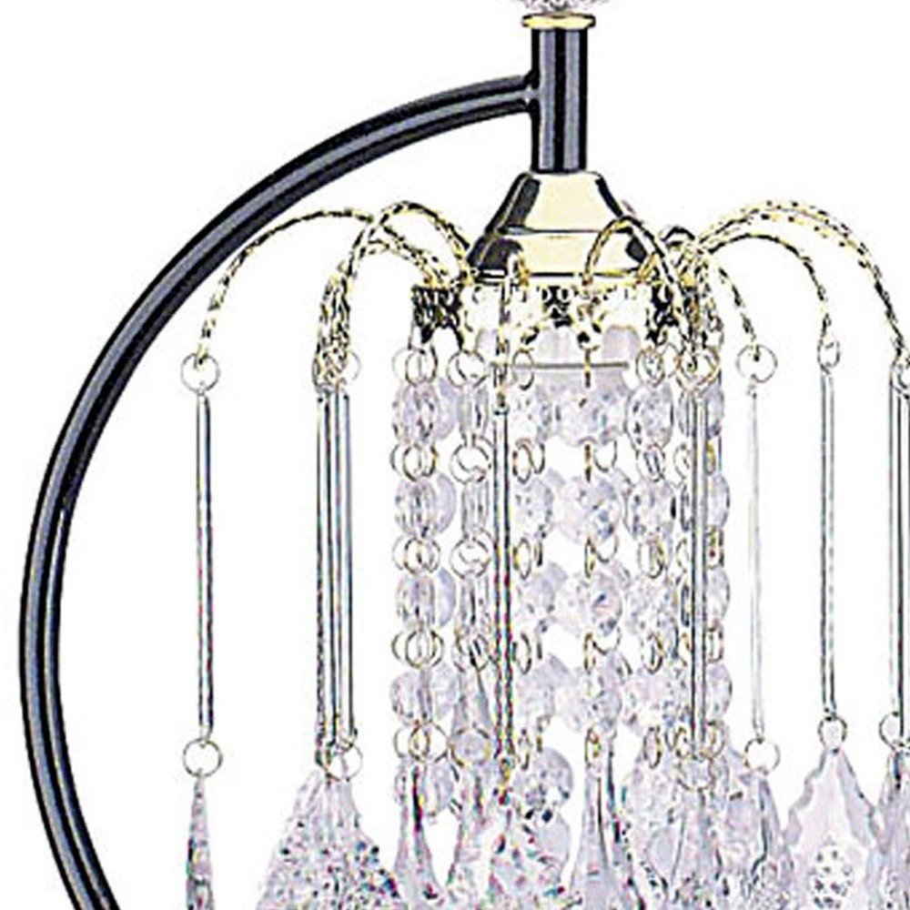 27" Black and Gold Metal Faux Crystal Chandelier Table Lamp. Chandelier isolated on a plain white background, showing a crystal surface.
