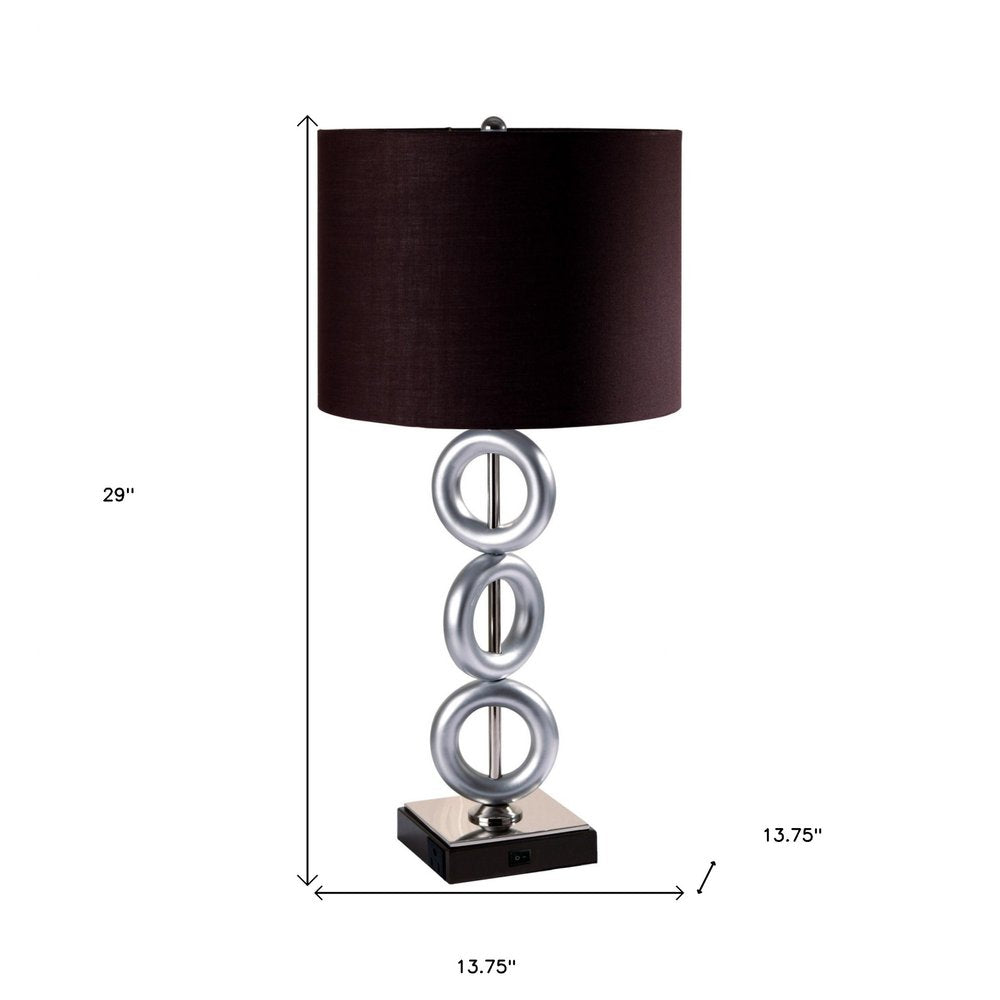 29" Silver Ceramic Geometric Table Lamp With Brown Classic Drum Shade. Table lamp isolated on a plain white background, in a silver ceramic finish.