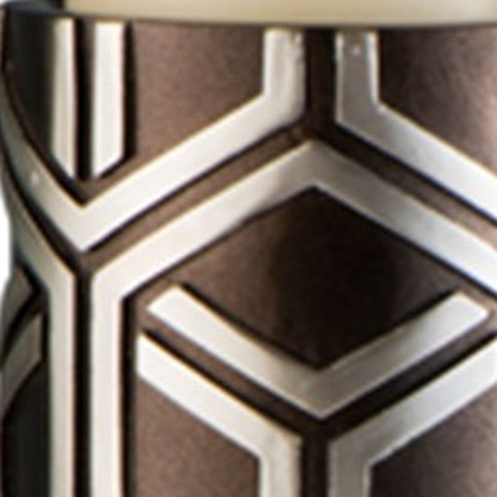 Set Of Two Espresso and Silver Pillar Tabletop Pillar Candle Holders in a home interior