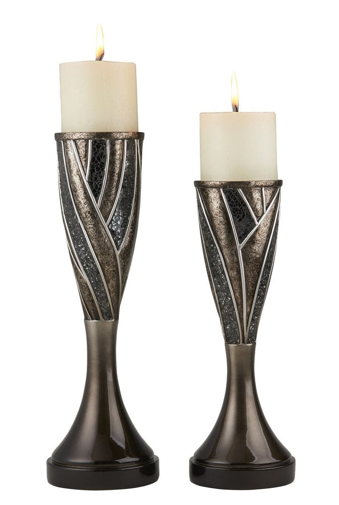 Two black, silver, and bronze polyresin abstract centerpiece pillar candle holders with candles on a white background.