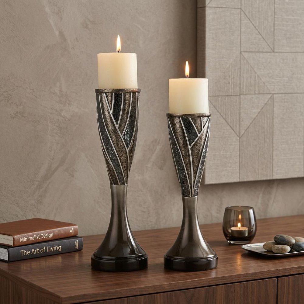 Set of Two Black Silver and Bronze Polyresin Abstract Centerpiece Pillar Candle Holders With Candle in a home interior