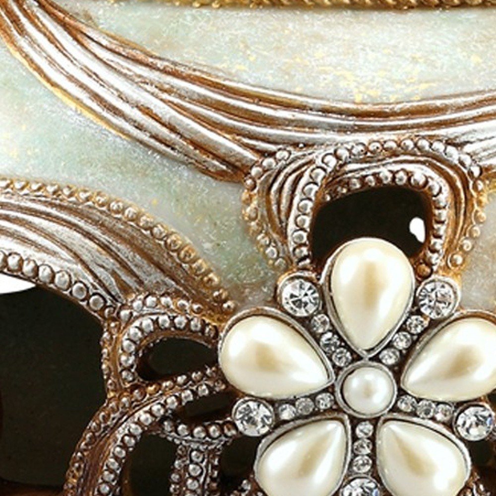 9" Bronze Gold And Light Green Resin Floral Scroll Jewelry Box With Gemstones and Crystals in a home interior
