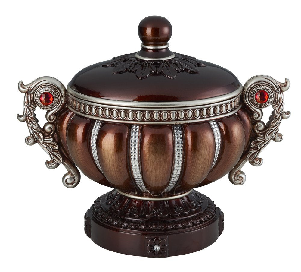 Bronze and silver resin jewelry box with red gem accents and ornate handles, on a dark brown base.
