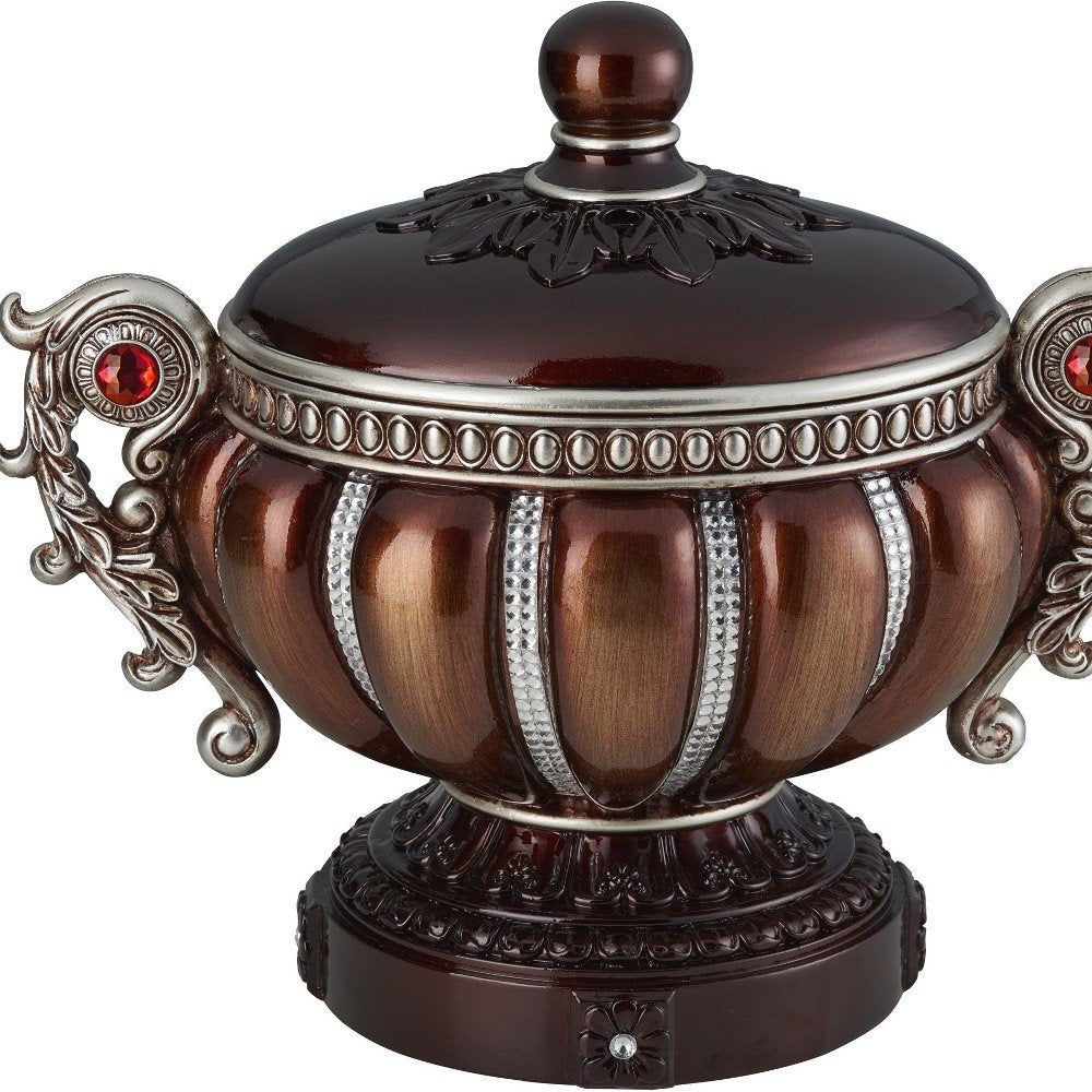 13" Bronze Red And Silver Resin Floral Scroll Jewelry Box With Metal Accents. Jewelry boxe isolated on a plain white background, showing a red metal surface.