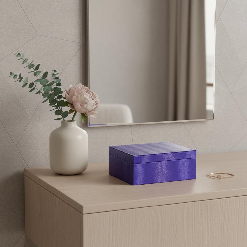10" Azure Faux Leather Six Section Mirrored Jewelry Box styled in a furnished interior with a tan wall on a wood floor in tan faux leather.