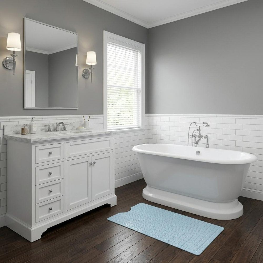 40" Light Blue Geometric Tiles Non Slip Bathtub Mat styled in a furnished interior with a gray wall on a dark wood floor.