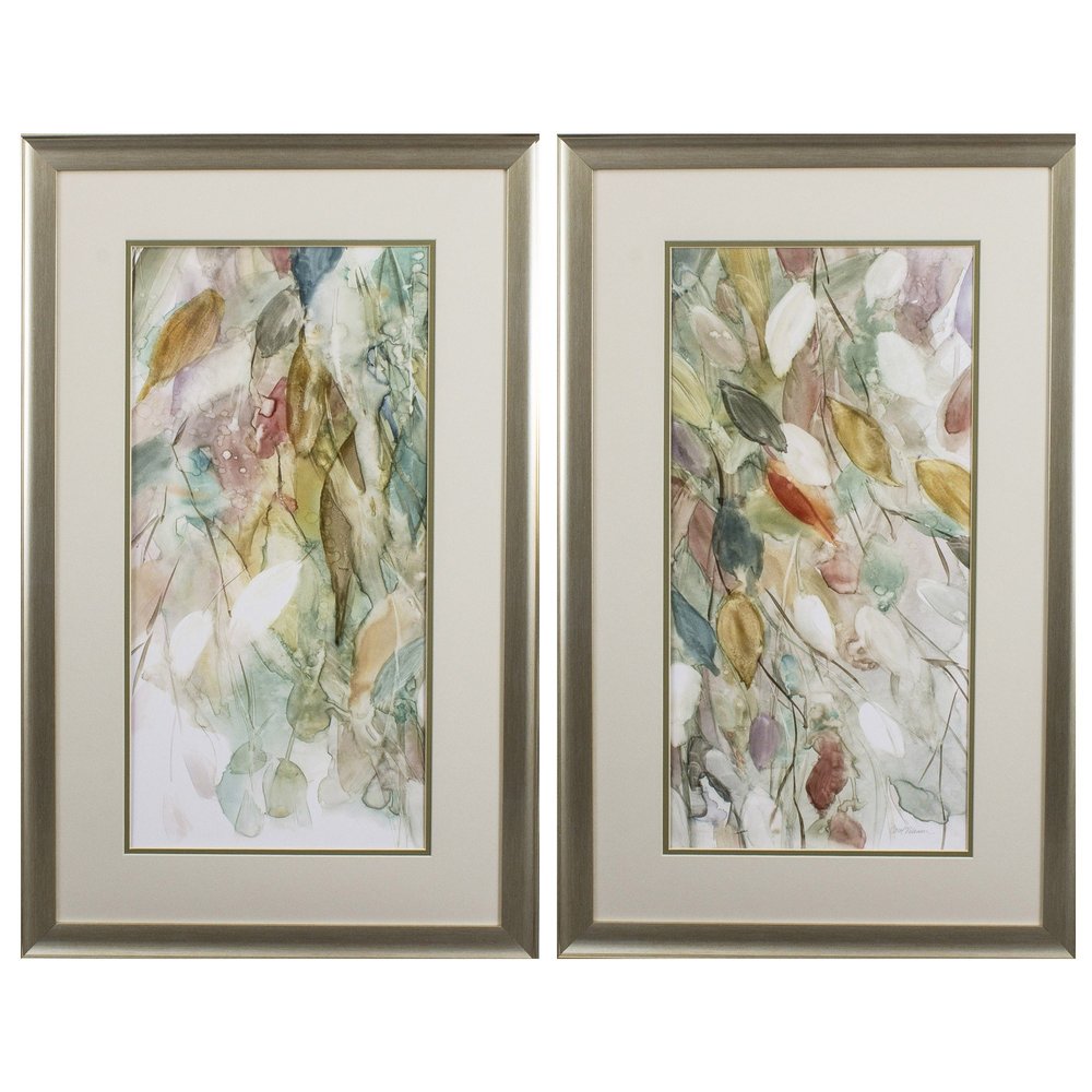 Two framed abstract watercolor paintings of blue and green leaves in silver frames.