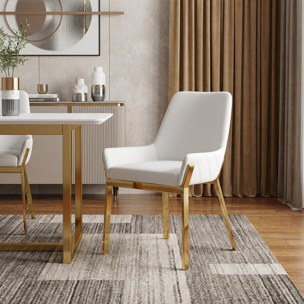 White and Gold Upholstered Faux Leather Dining Arm Chair in a home interior