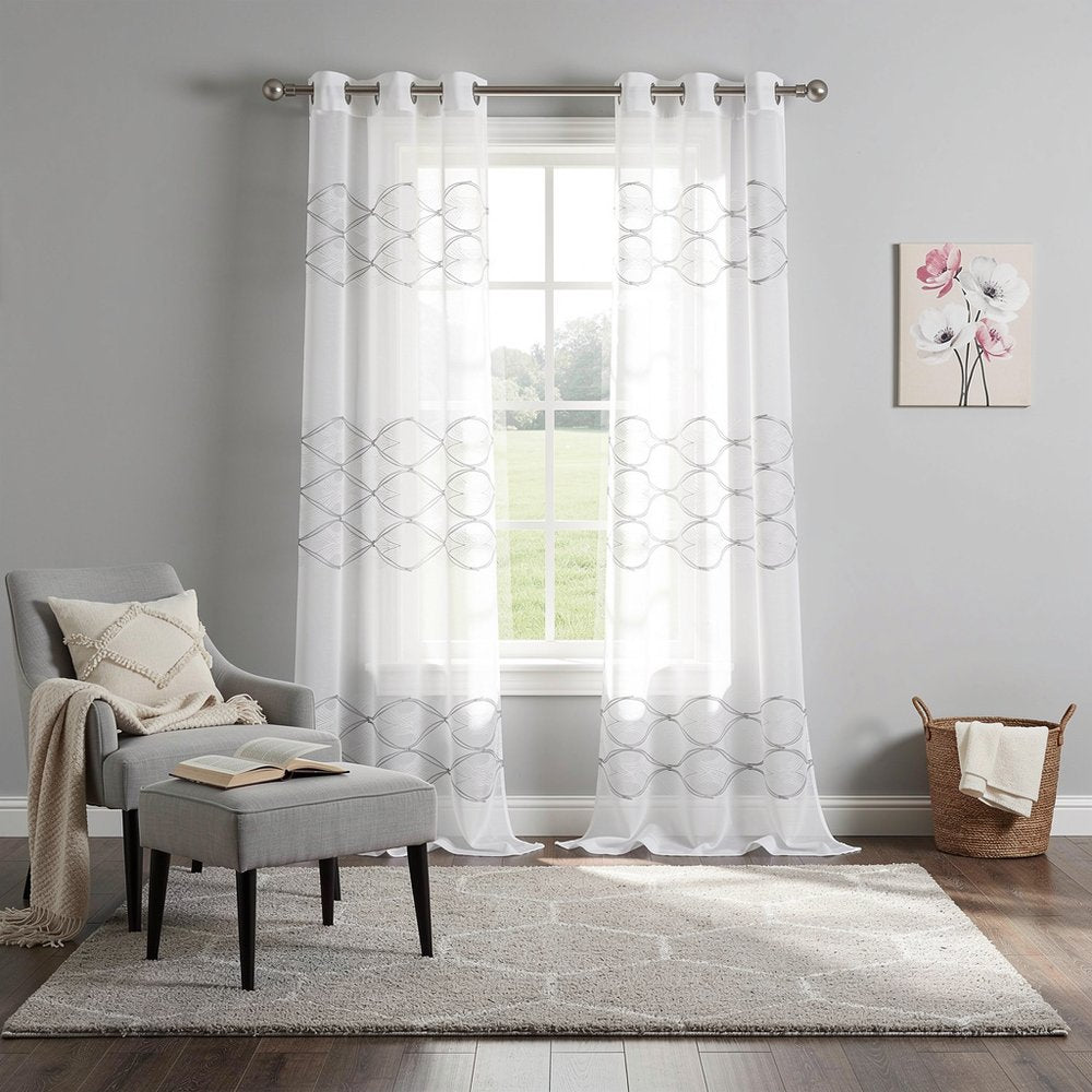 Set of Two 84" White Wave Embroidered Window Panels in a home interior