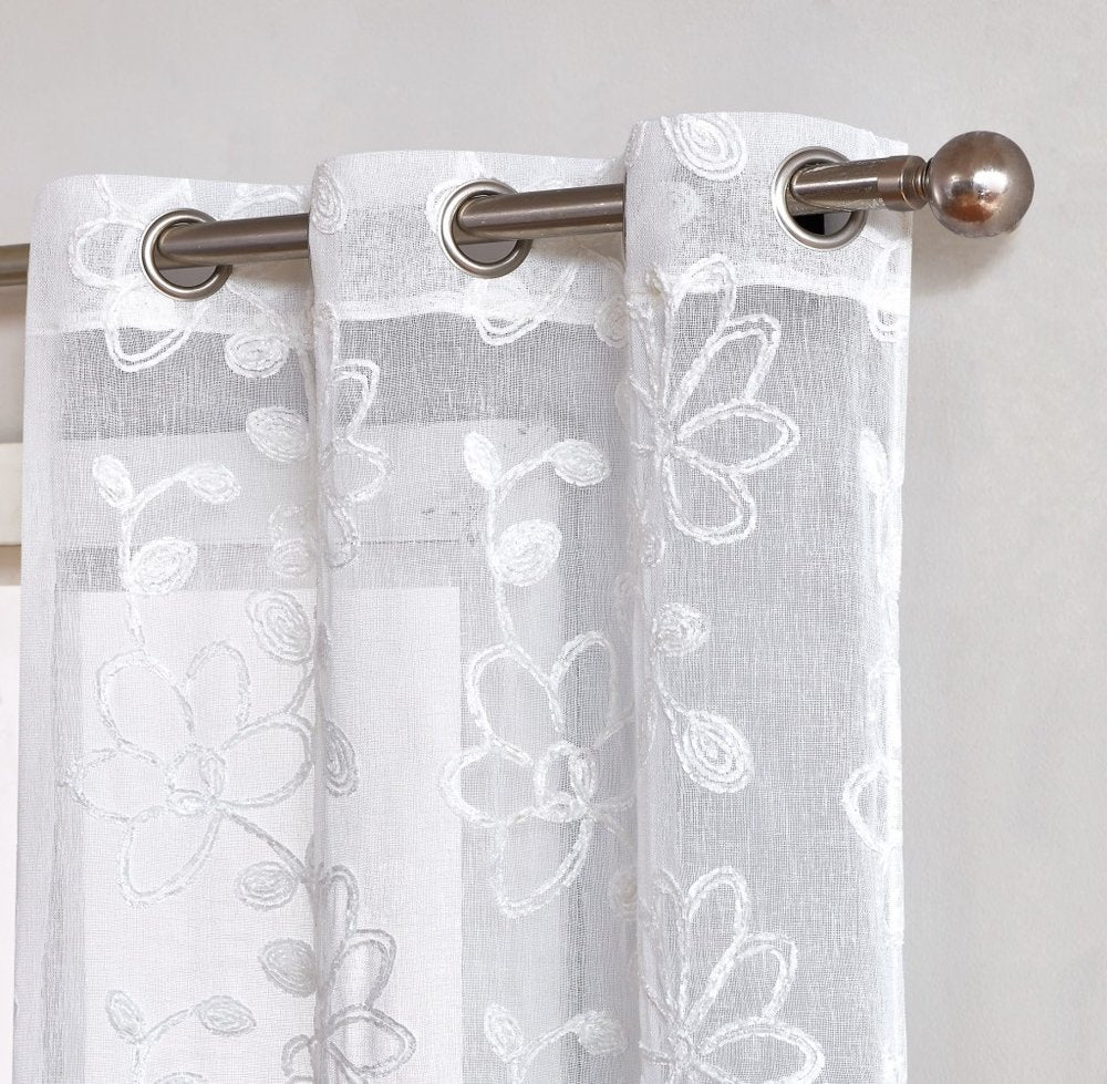 Set of Two 96" White Floral Embroidered Window Panels on a white background