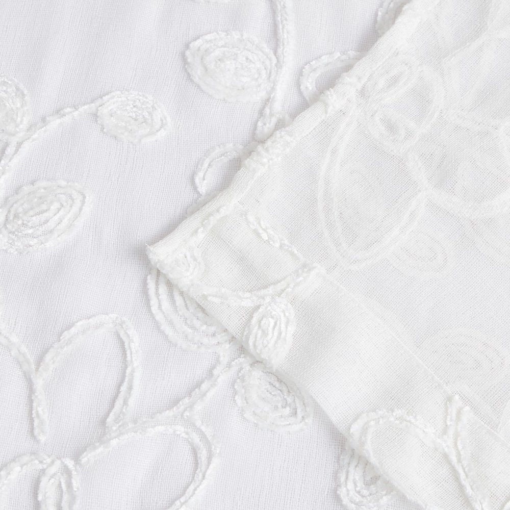 Set of Two 96" White Floral Embroidered Window Panels on a white background