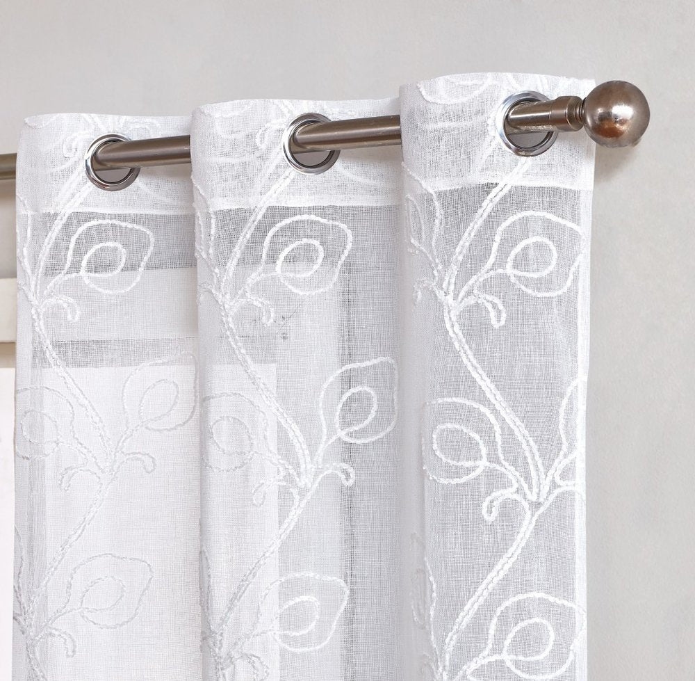 Set of Two 84" White Boho Embroidered Window Panels on a white background