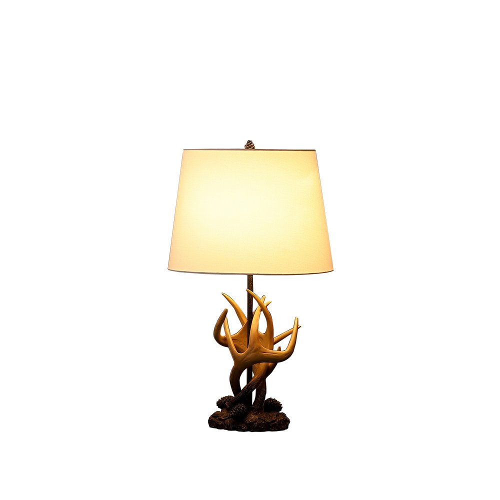 26" Natural And Brown Antlers Table Lamp With White Shade. Table lamp isolated on a plain white background, finished in white.