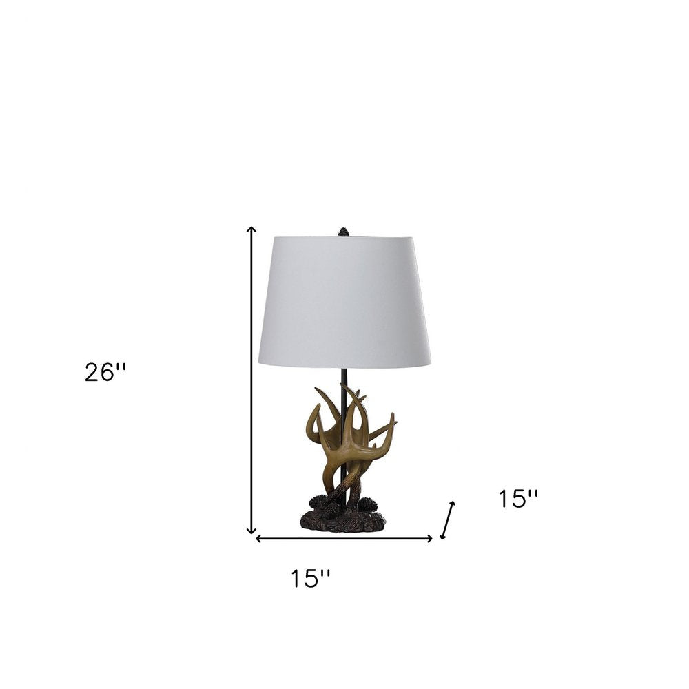 26" Natural And Brown Antlers Table Lamp With White Shade. Table lamp isolated on a plain white background, showing its white color.