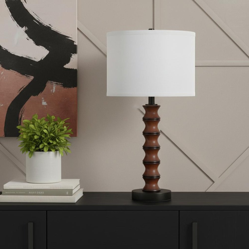 28" Dark Cherry Polyresin Indents Table Lamp With White Shade photographed against a dark studio background.