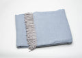 Sky Blue Mini Dot Fringed Throw Blanket on a white background