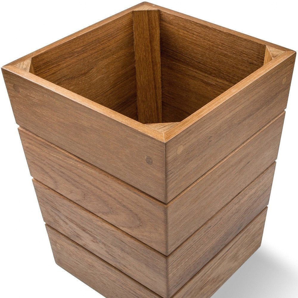 10" Traditional Solid Teak Small Waste Basket. Bath accessorie isolated on a plain white background, showing a brown teak surface.