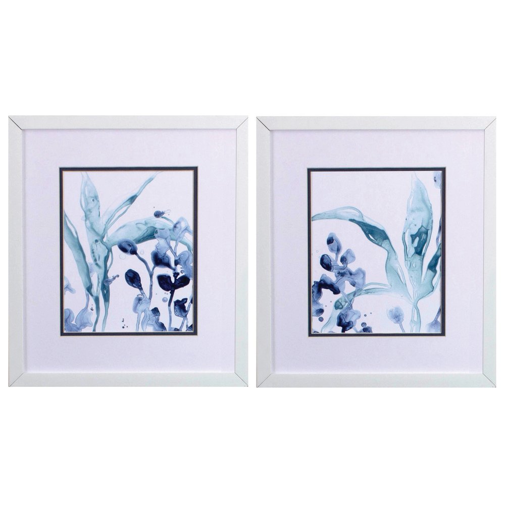 Set of two framed abstract blue floral watercolor paintings with white mats and white frames.