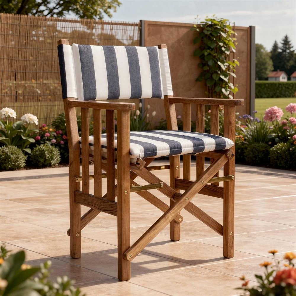 20" Blue and White and Natural Wood Solid Wood Indoor Outdoor Director Chair with Blue and White Cushion. Navy-and-white striped wooden director chair on a tiled patio with garden greenery behind it.