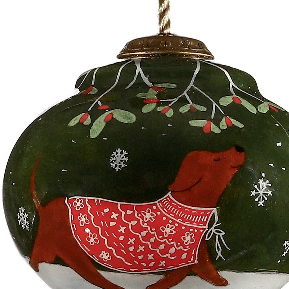 Trotting Dog in Comfy Christmas Attire Hand Painted Mouth Blown Glass Ornament on a white background