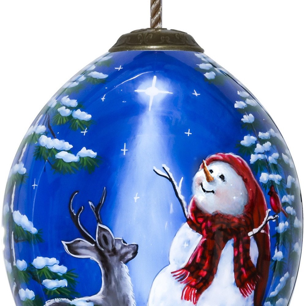 Starry Heaven and Snowman Hand Painted Mouth Blown Glass Ornament on a white background
