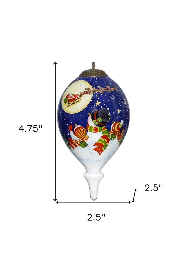 Snowmen Family Watching Santa on a Sleigh Hand Painted Mouth Blown Glass Ornament on a white background